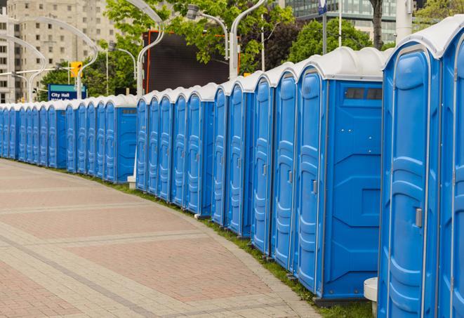 a row of portable restrooms set up for a special event, providing guests with a comfortable and sanitary option in Aurora